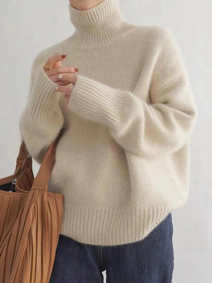 Women's ribbed knit turtleneck pullover in cream with long sleeves
