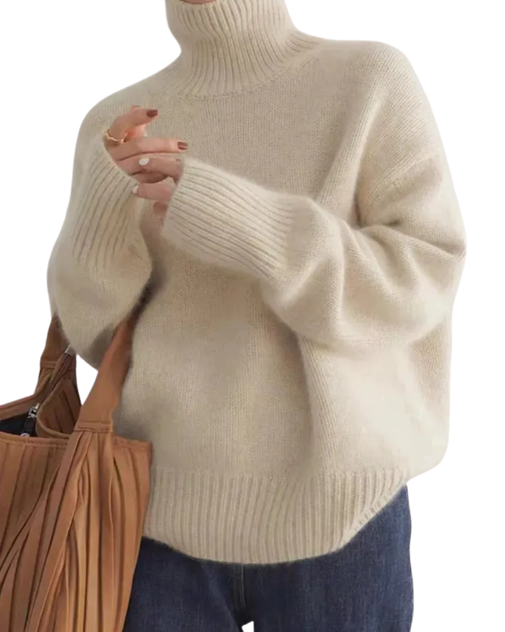 Women's ribbed knit turtleneck pullover in cream with long sleeves