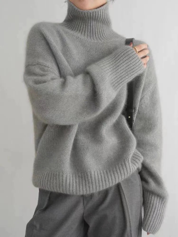 Women's ribbed knit turtleneck pullover in cream with long sleeves