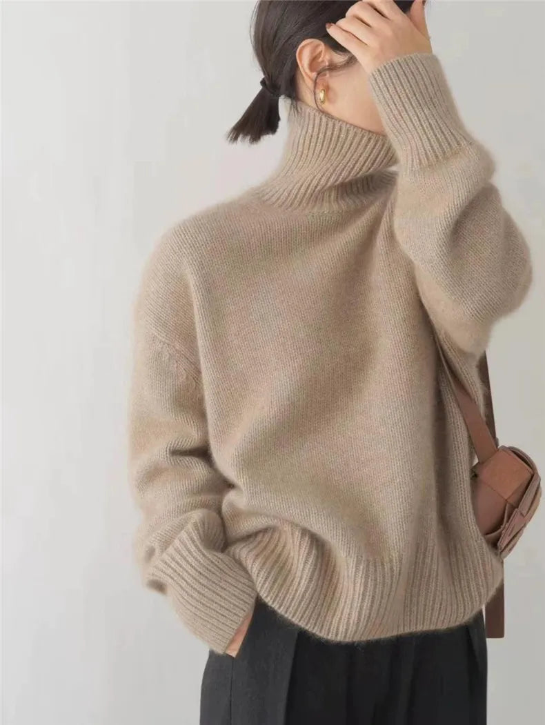 Women's ribbed knit turtleneck pullover in cream with long sleeves