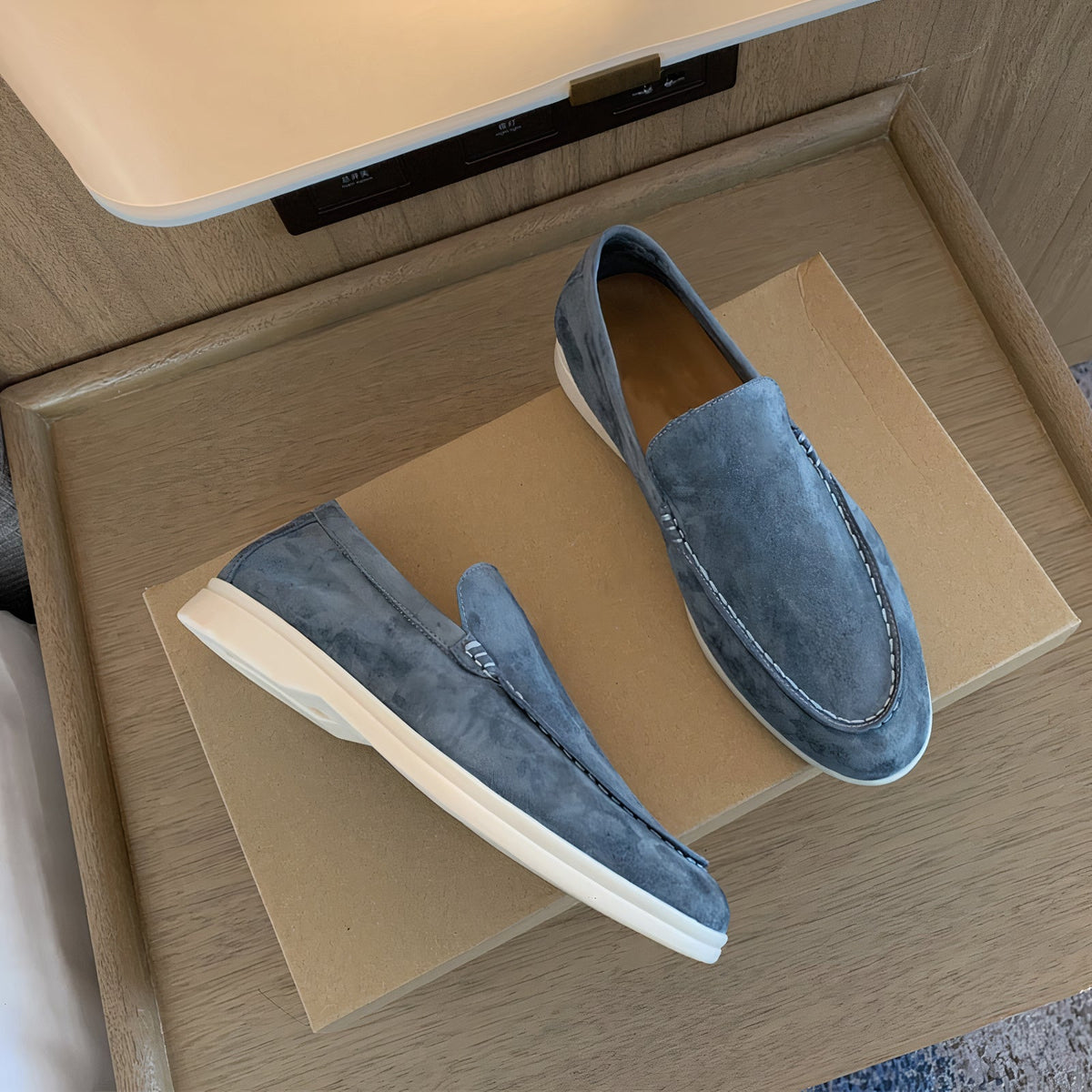 Men's slip-on loafers with stitched apron toes and flat soles