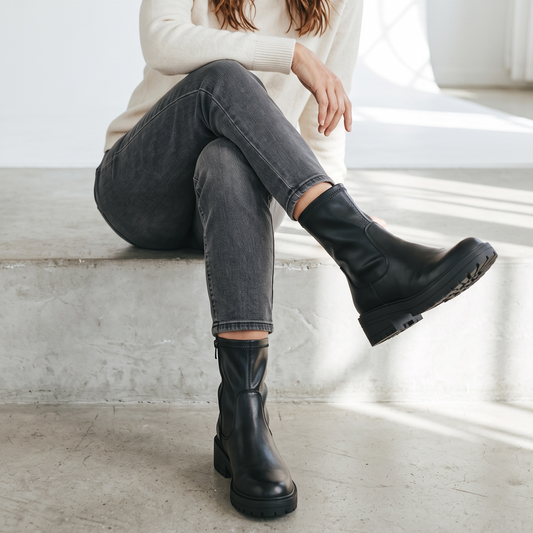 Women's black chunky biker ankle boots with side zips and lugged soles