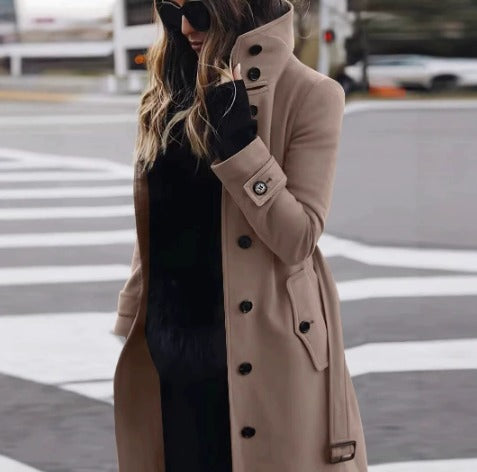 Women's knee-length button-front coat with stand collar and flap pockets