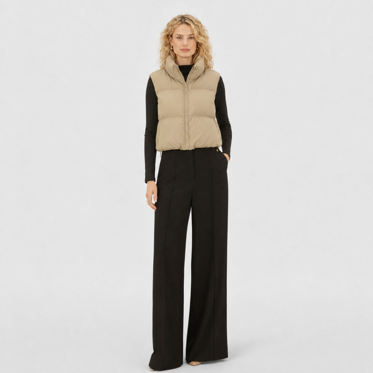 Women's cropped quilted puffer vest with high collar and zip front