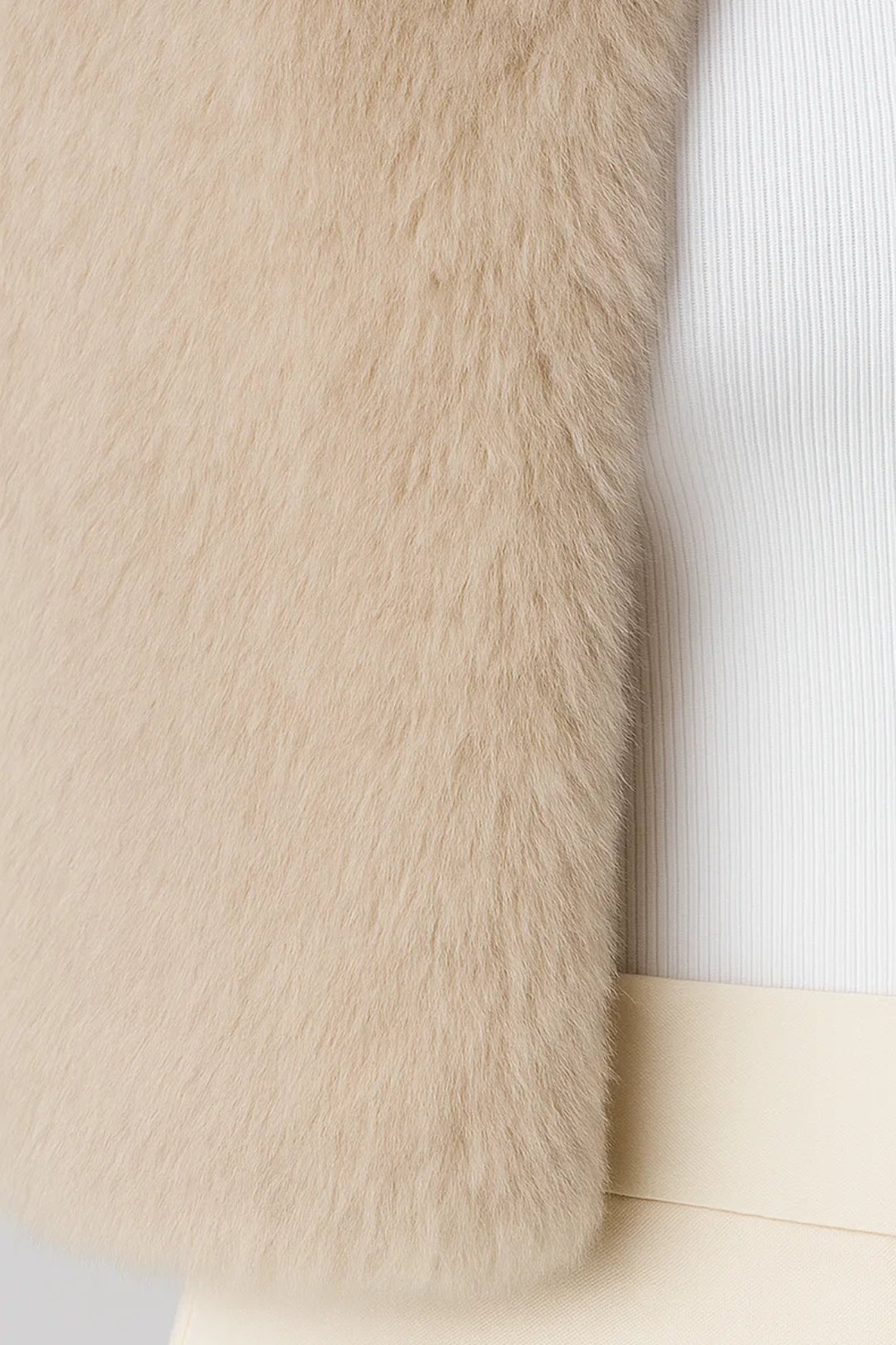 Women's short textured jacket shown in beige and black with long sleeves and an open front
