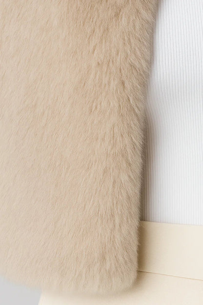 Women's short textured jacket shown in beige and black with long sleeves and an open front