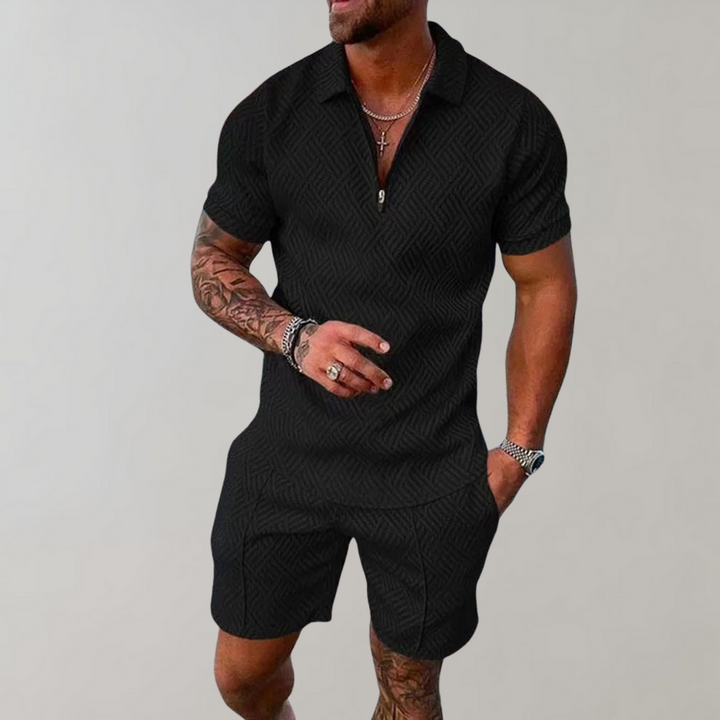 Man wearing a quarter-zip short-sleeve polo in a textured geometric knit with matching shorts