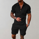 Man wearing a quarter-zip short-sleeve polo in a textured geometric knit with matching shorts