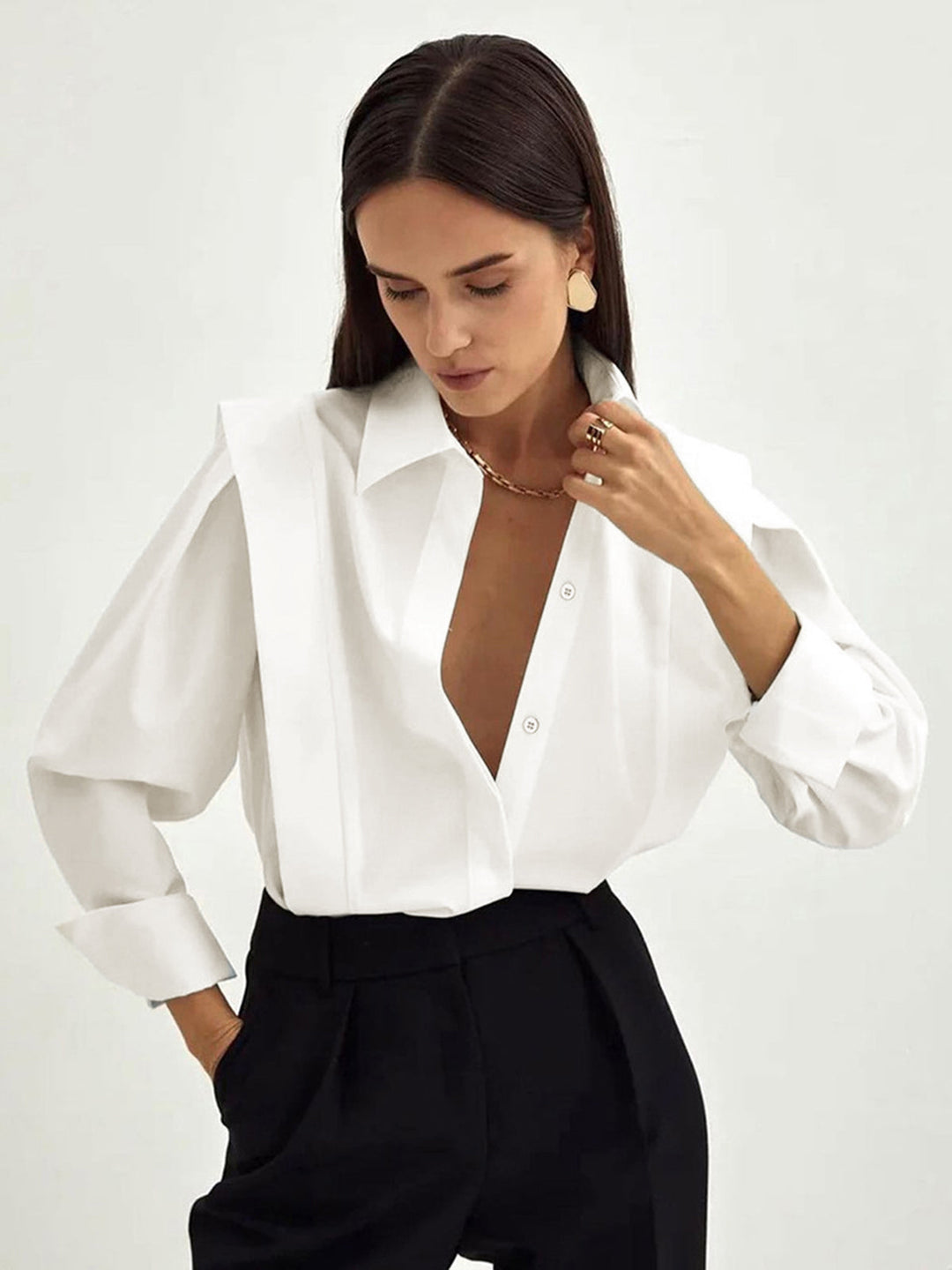 Women's white button-up shirt with wide cuffs and pointed collar, long sleeves