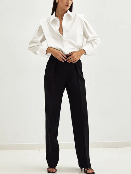 Women's white button-up shirt with wide cuffs and pointed collar, long sleeves