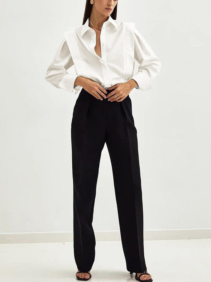 Women's white button-up shirt with wide cuffs and pointed collar, long sleeves