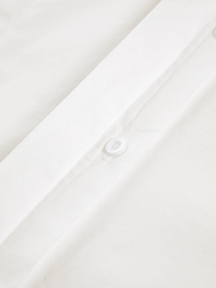 Women's white button-up shirt with wide cuffs and pointed collar, long sleeves