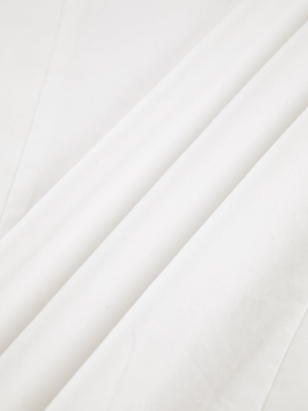 Women's white button-up shirt with wide cuffs and pointed collar, long sleeves