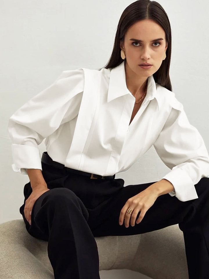 Women's white button-up shirt with wide cuffs and pointed collar, long sleeves