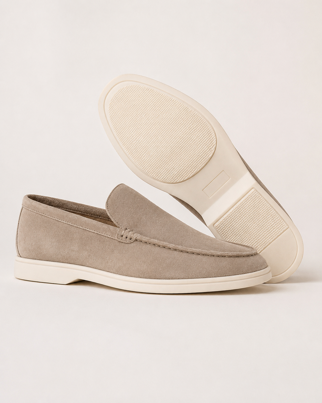 Men's slip-on loafers with rounded toes, stitched trim and flat soles