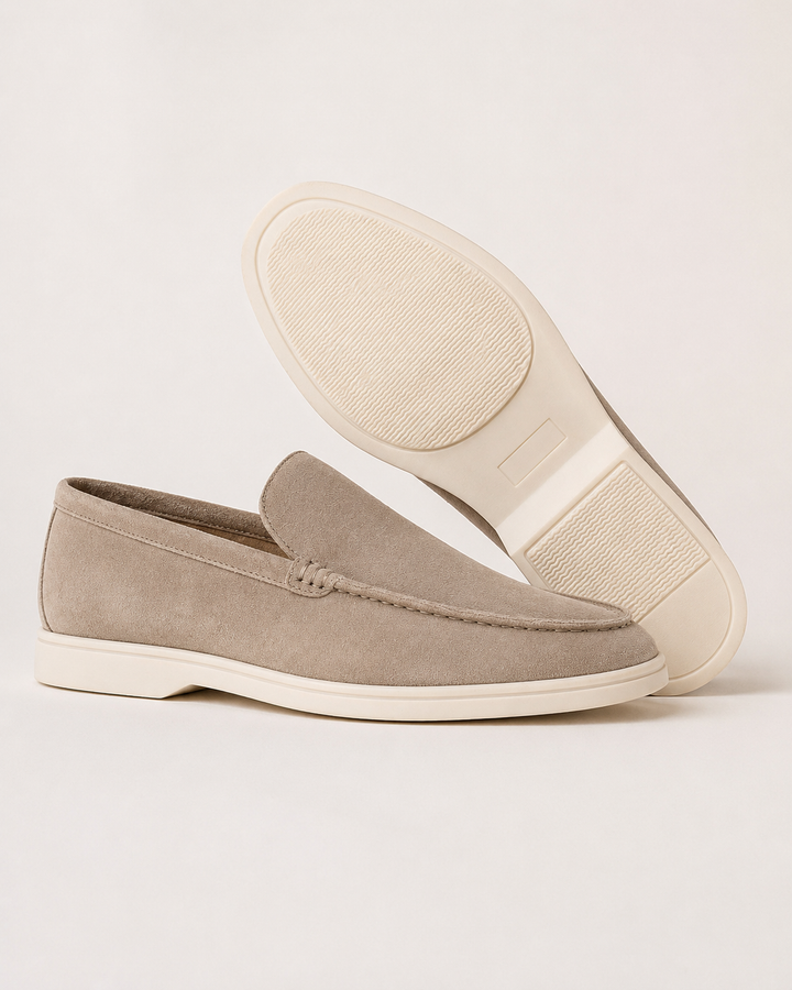 Men's slip-on loafers with rounded toes, stitched trim and flat soles
