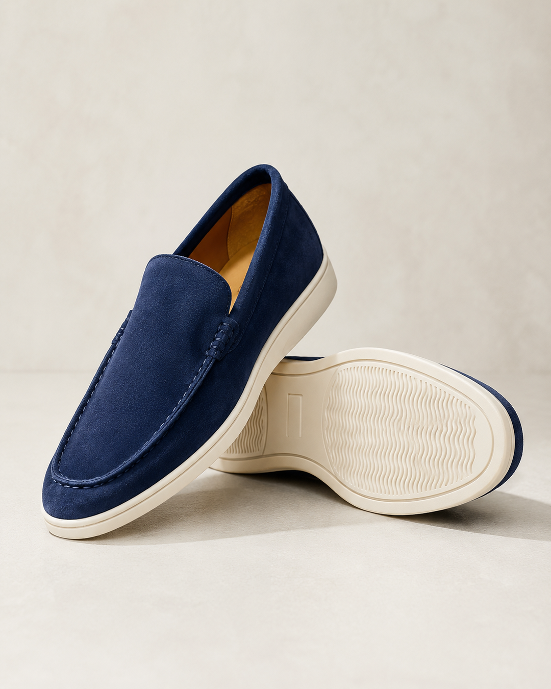 Men's slip-on loafers with rounded toes, stitched trim and flat soles