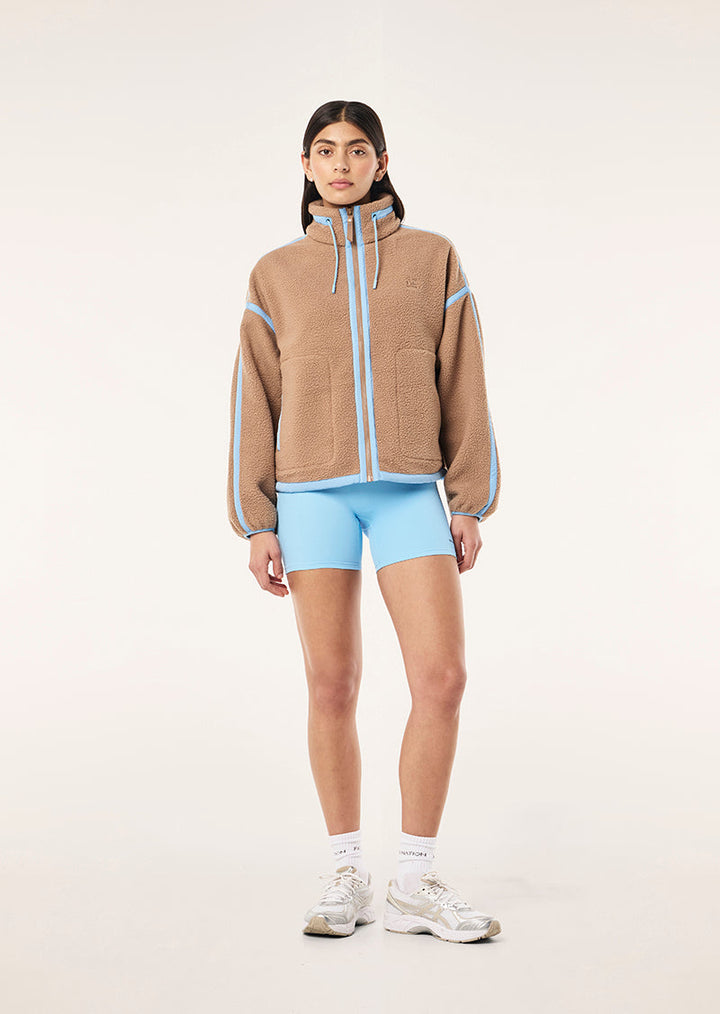 Women's brown sherpa jacket with blue contrast trim and hood