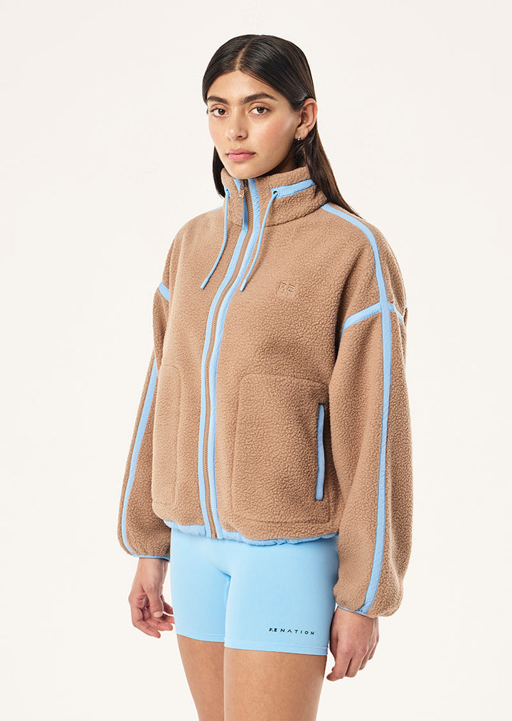 Women's brown sherpa jacket with blue contrast trim and hood