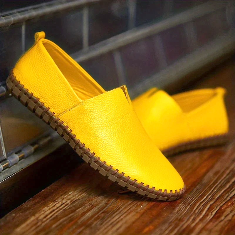 Men's textured slip-on loafer with round toe, flat sole and contrast stitched edge