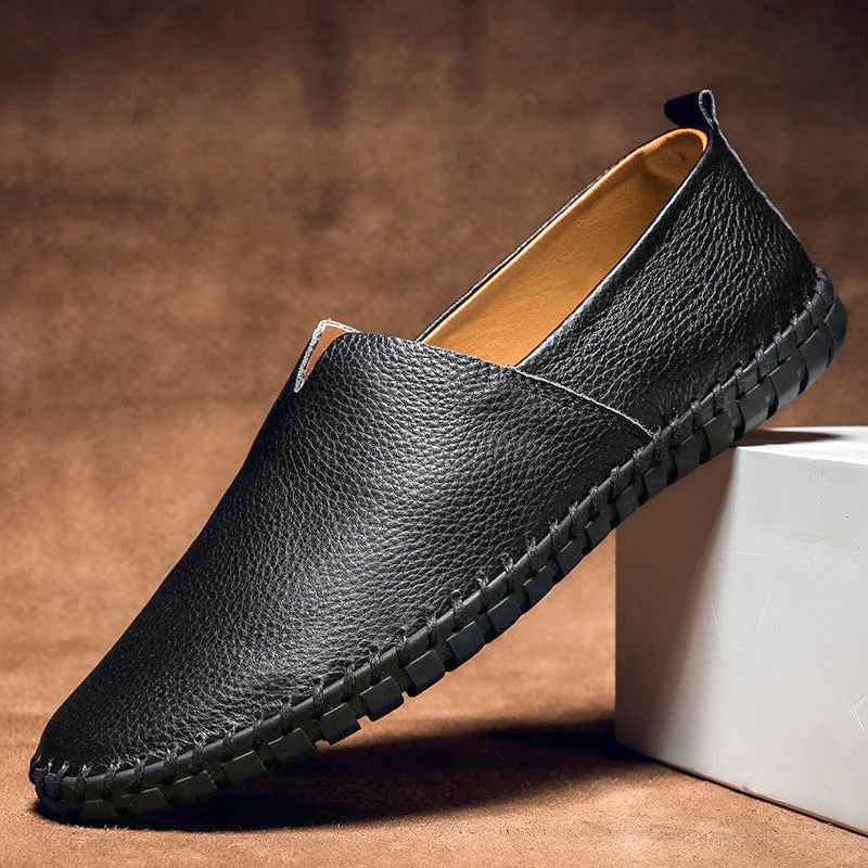 Men's textured slip-on loafer with round toe, flat sole and contrast stitched edge