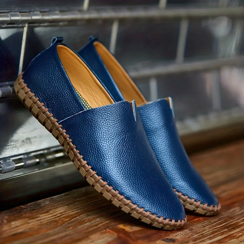 Men's textured slip-on loafer with round toe, flat sole and contrast stitched edge