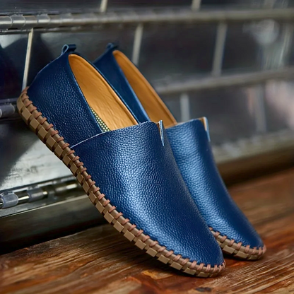 Men's textured slip-on loafer with round toe, flat sole and contrast stitched edge