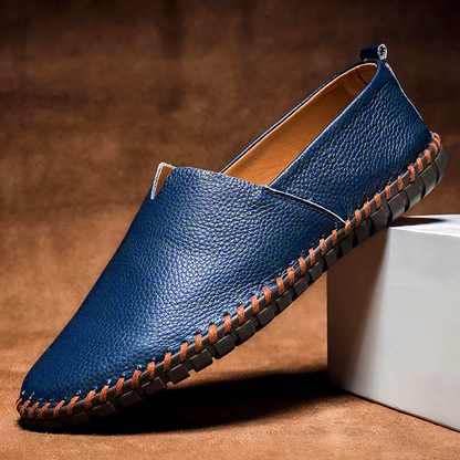 Men's textured slip-on loafer with round toe, flat sole and contrast stitched edge