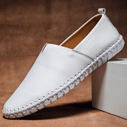 Men's textured slip-on loafer with round toe, flat sole and contrast stitched edge
