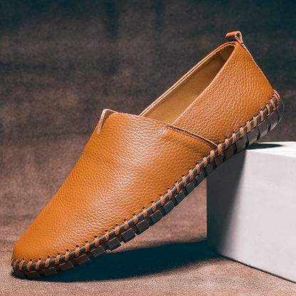 Men's textured slip-on loafer with round toe, flat sole and contrast stitched edge
