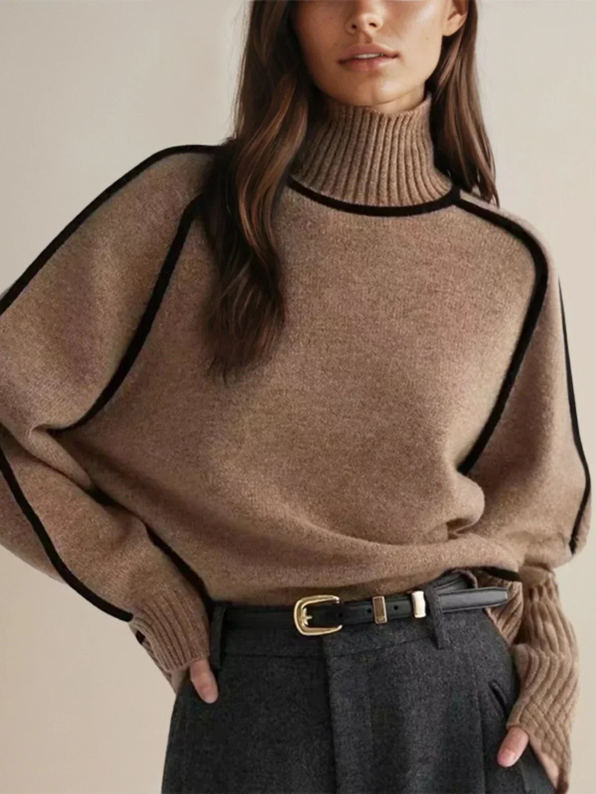 Women's oversized turtleneck sweater with contrast piping and long sleeves