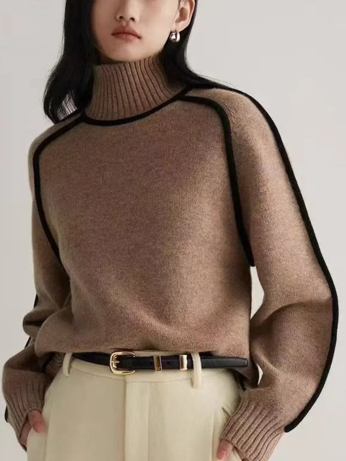 Women's oversized turtleneck sweater with contrast piping and long sleeves