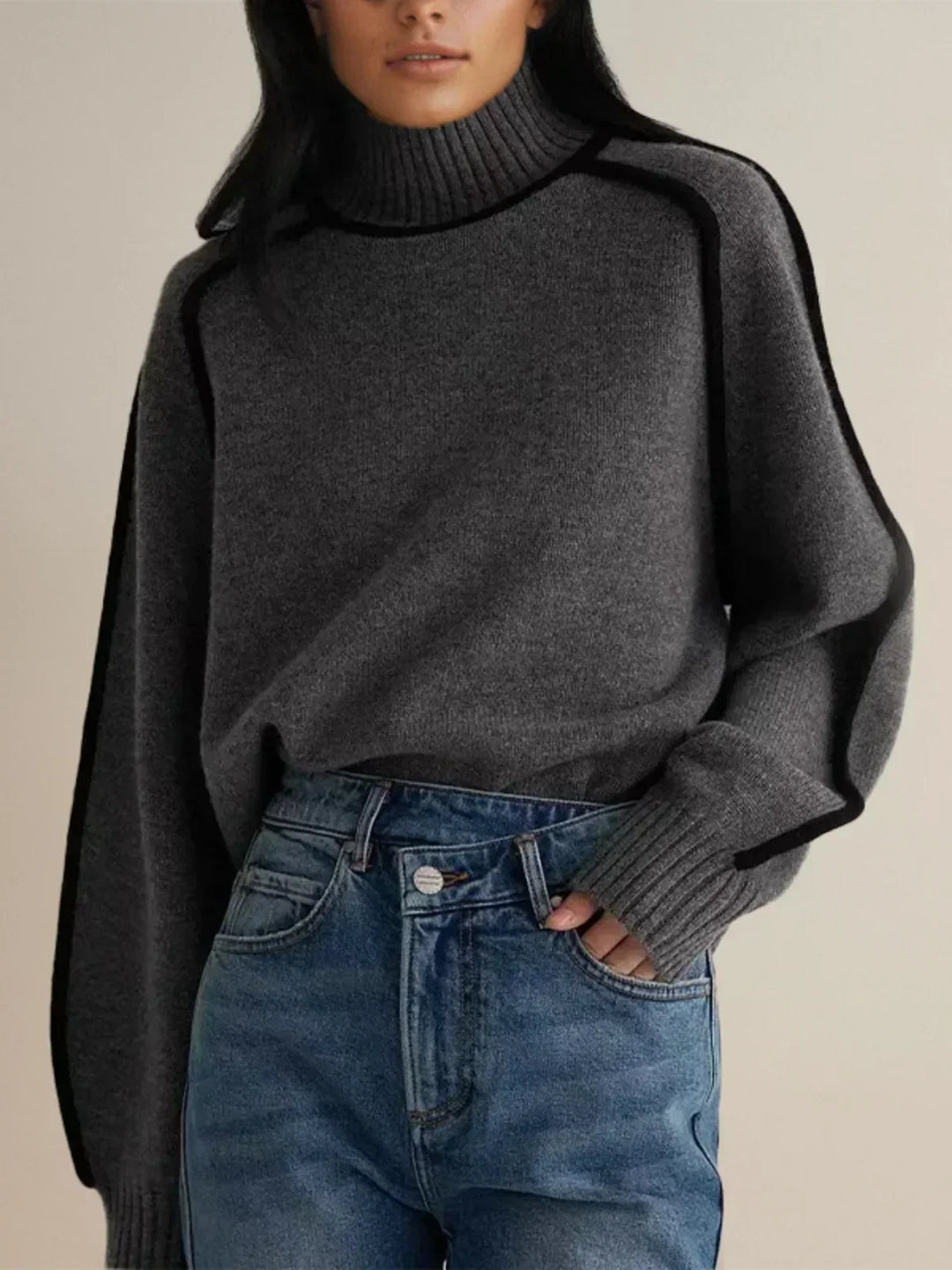 Women's oversized turtleneck sweater with contrast piping and long sleeves