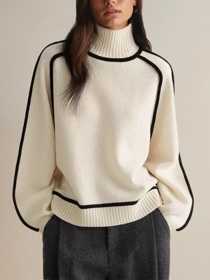 Women's oversized turtleneck sweater with contrast piping and long sleeves