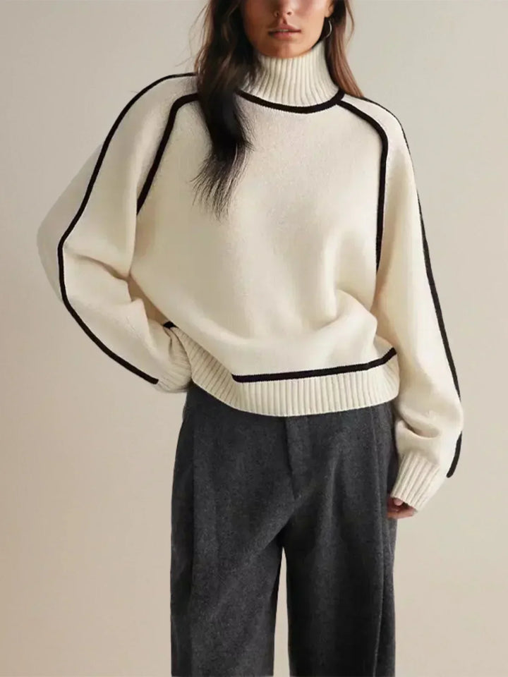 Women's oversized turtleneck sweater with contrast piping and long sleeves