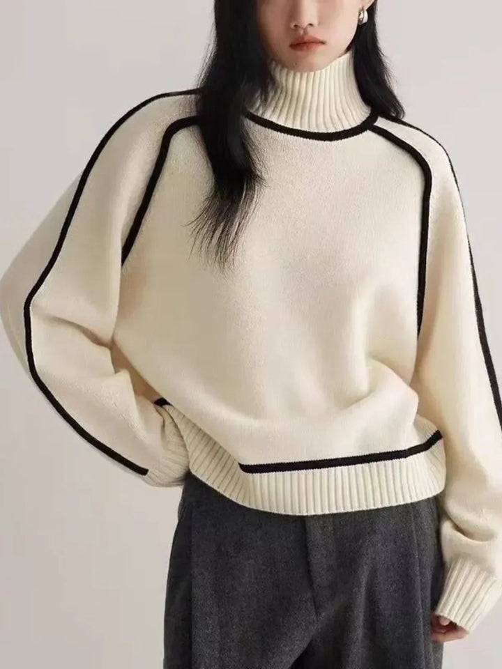 Women's oversized turtleneck sweater with contrast piping and long sleeves