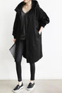 Women's hooded longline trench coat with button front, elastic cuffs and side pockets