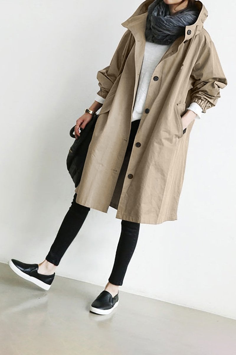 Women's hooded longline trench coat with button front, elastic cuffs and side pockets