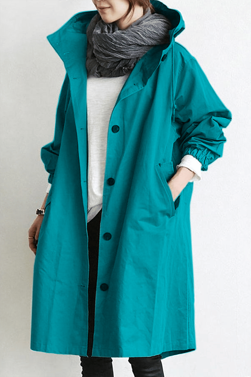 Women's hooded longline trench coat with button front, elastic cuffs and side pockets