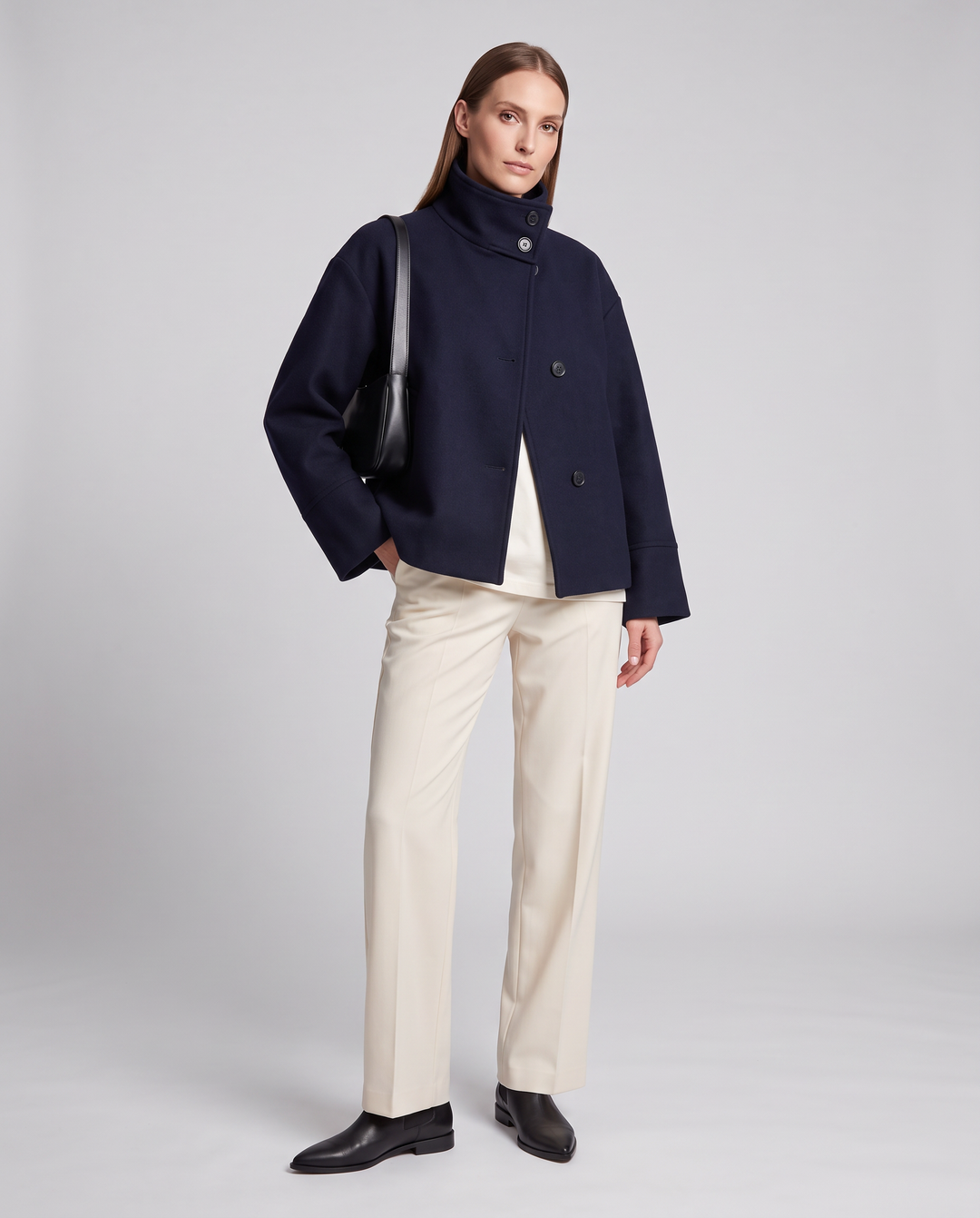 Women's navy short coat with stand collar, long sleeves and button front