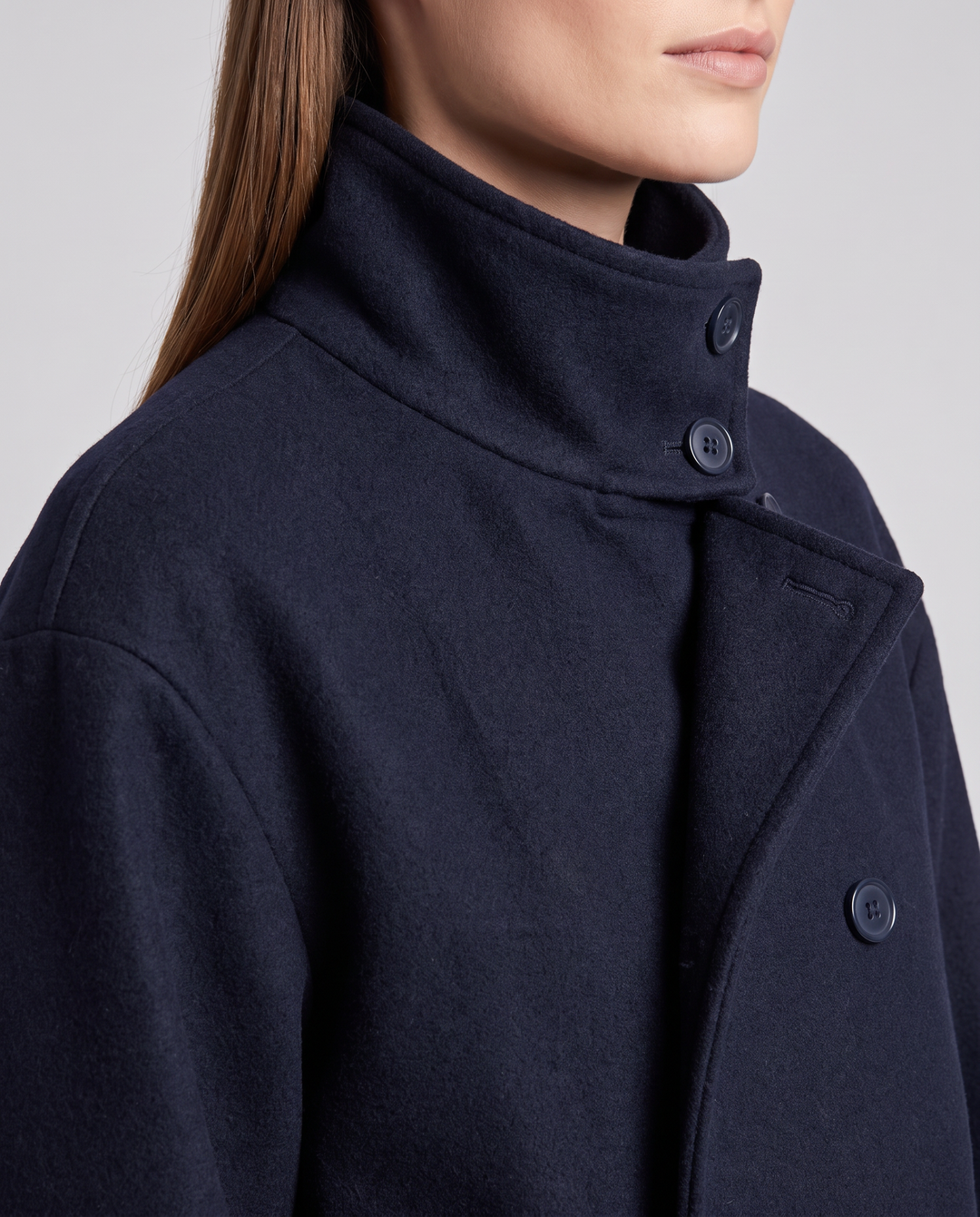 Women's navy short coat with stand collar, long sleeves and button front