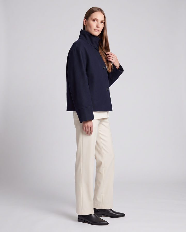 Women's navy short coat with stand collar, long sleeves and button front