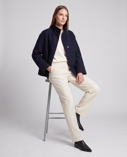 Women's navy short coat with stand collar, long sleeves and button front