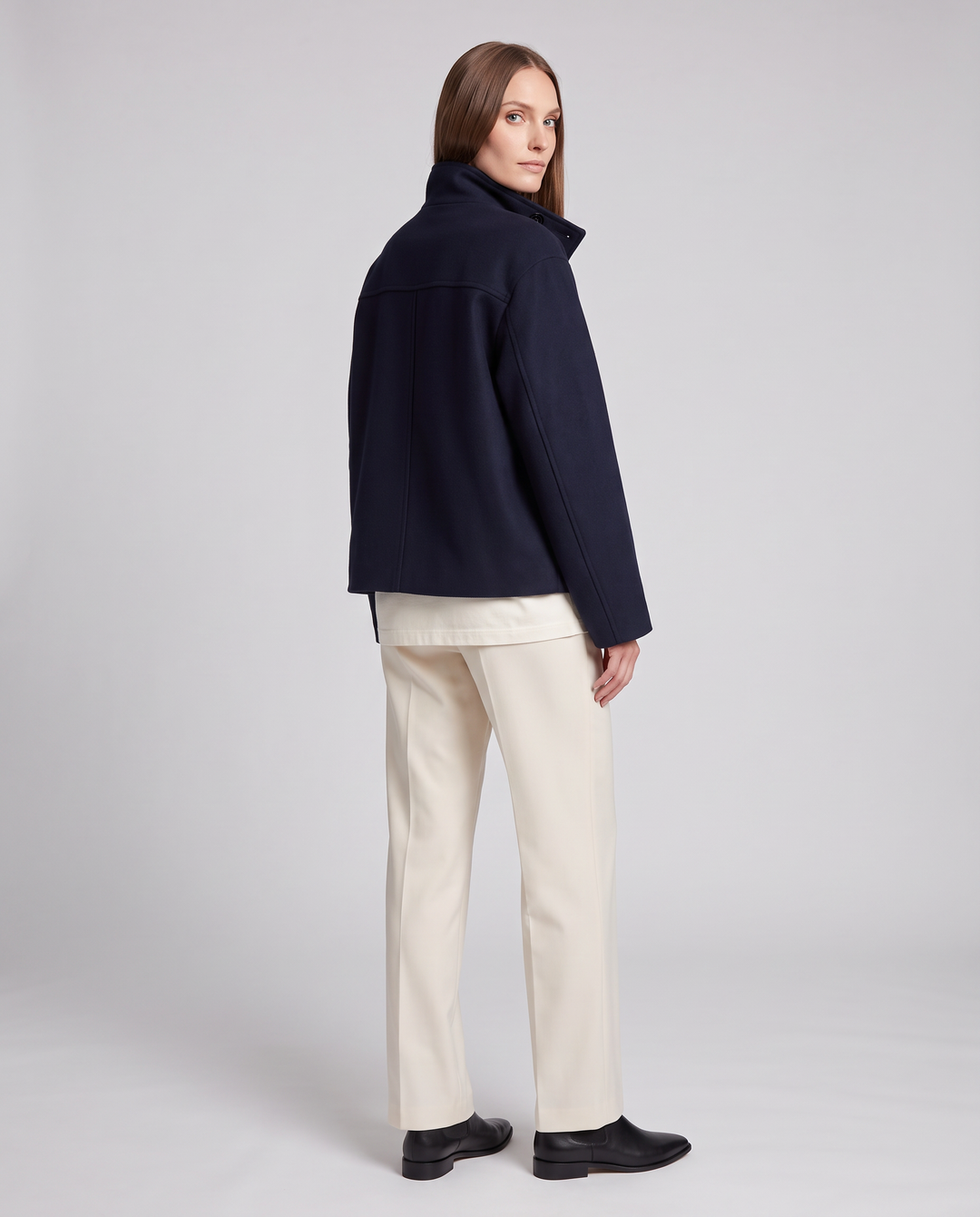 Women's navy short coat with stand collar, long sleeves and button front