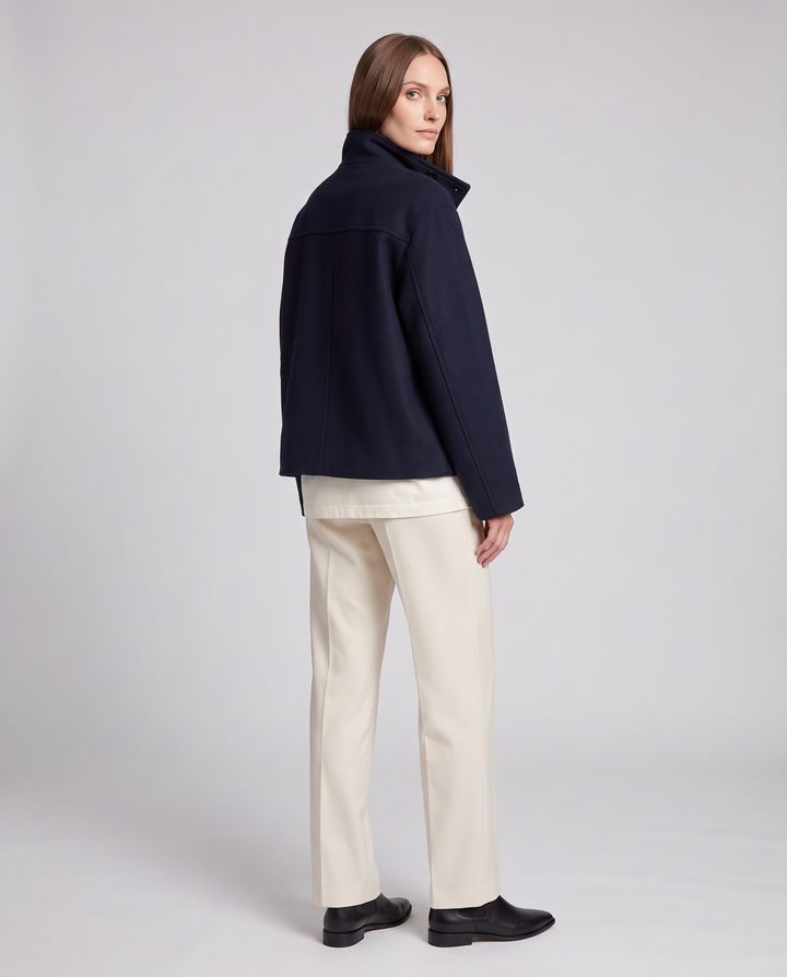 Women's navy short coat with stand collar, long sleeves and button front
