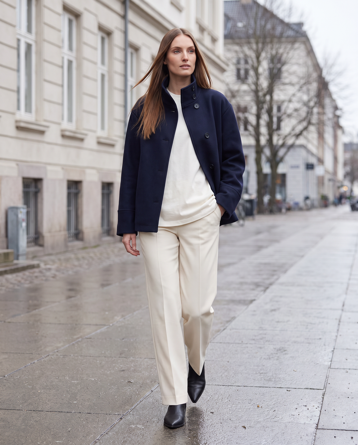 Women's navy short coat with stand collar, long sleeves and button front