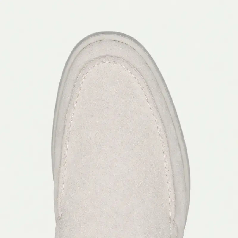 Men's off-white slip-on loafers with rounded toes and flat soles