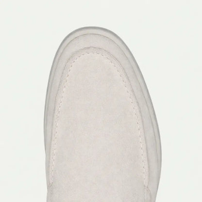 Men's off-white slip-on loafers with rounded toes and flat soles