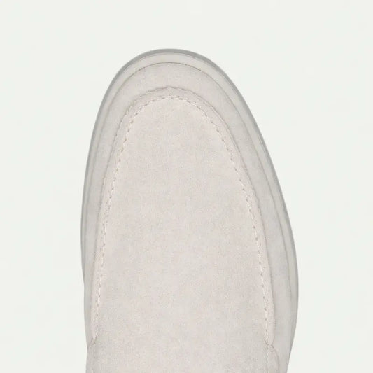 Men's off-white slip-on loafers with rounded toes and flat soles