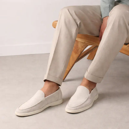 Men's off-white slip-on loafers with rounded toes and flat soles